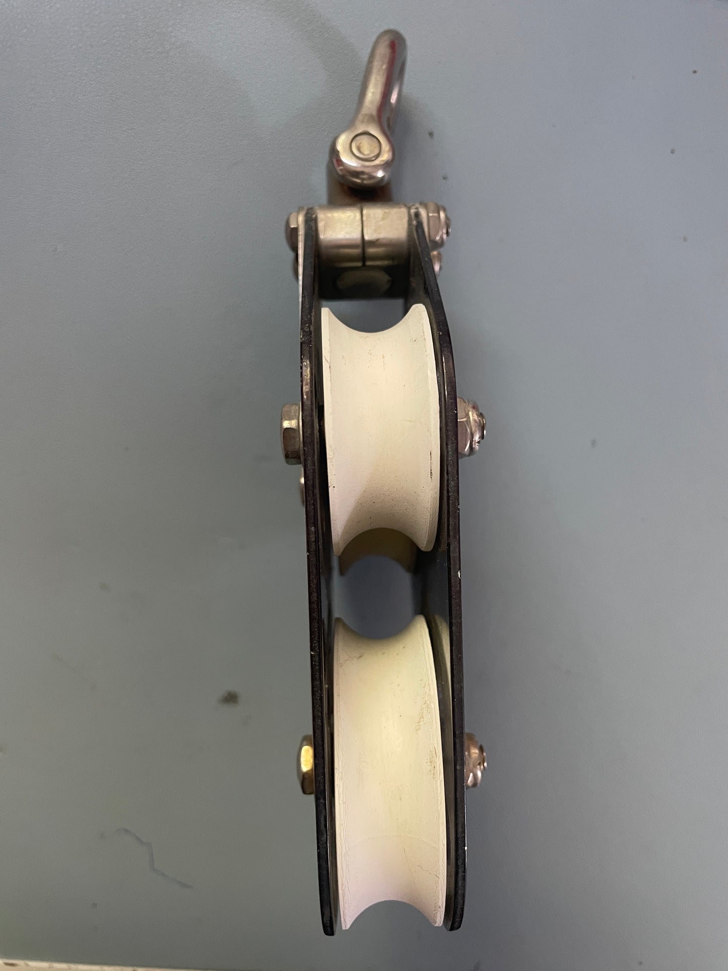 Mechanical pulley system on a gray background