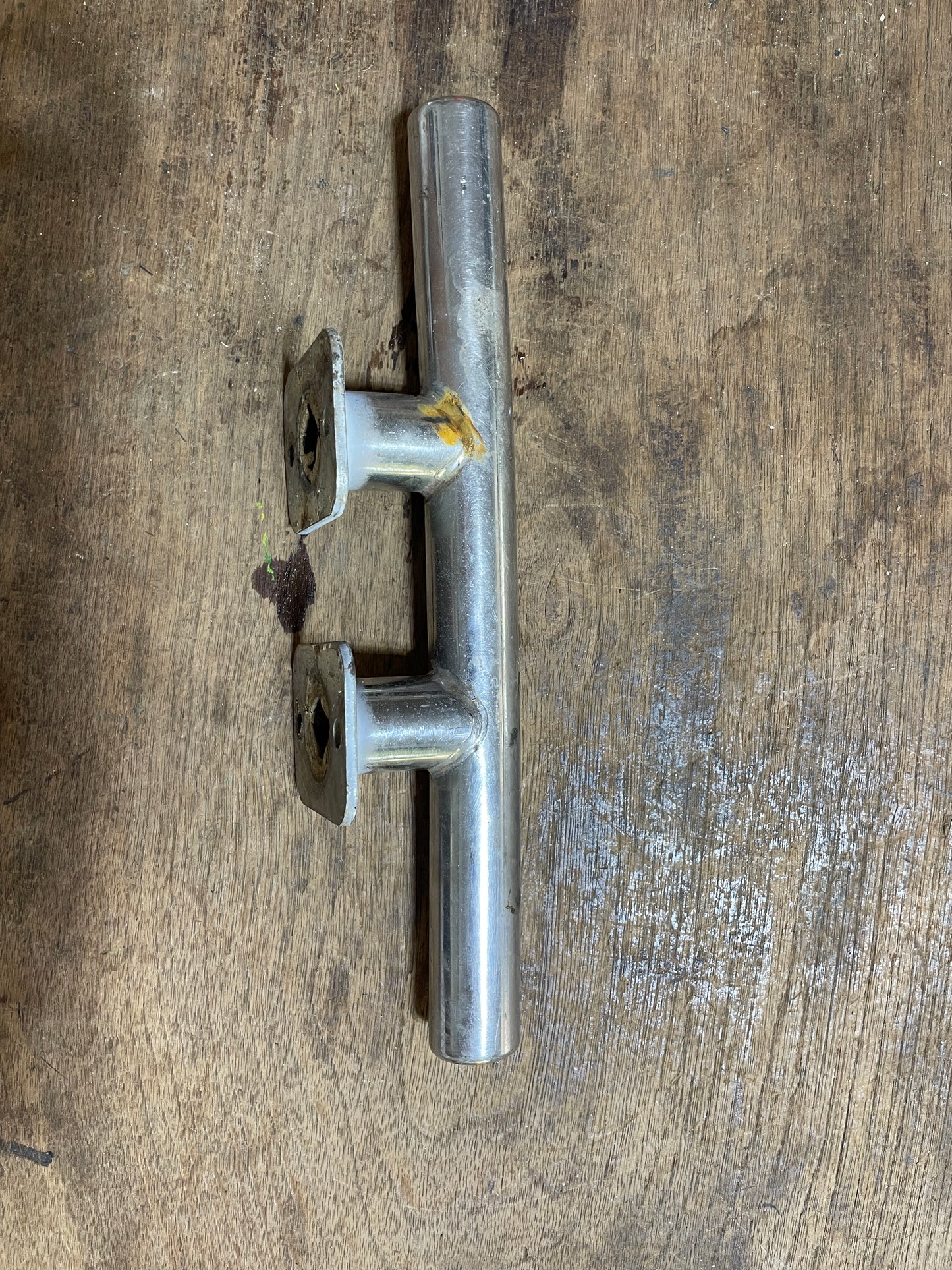Metal cleat on a wooden surface