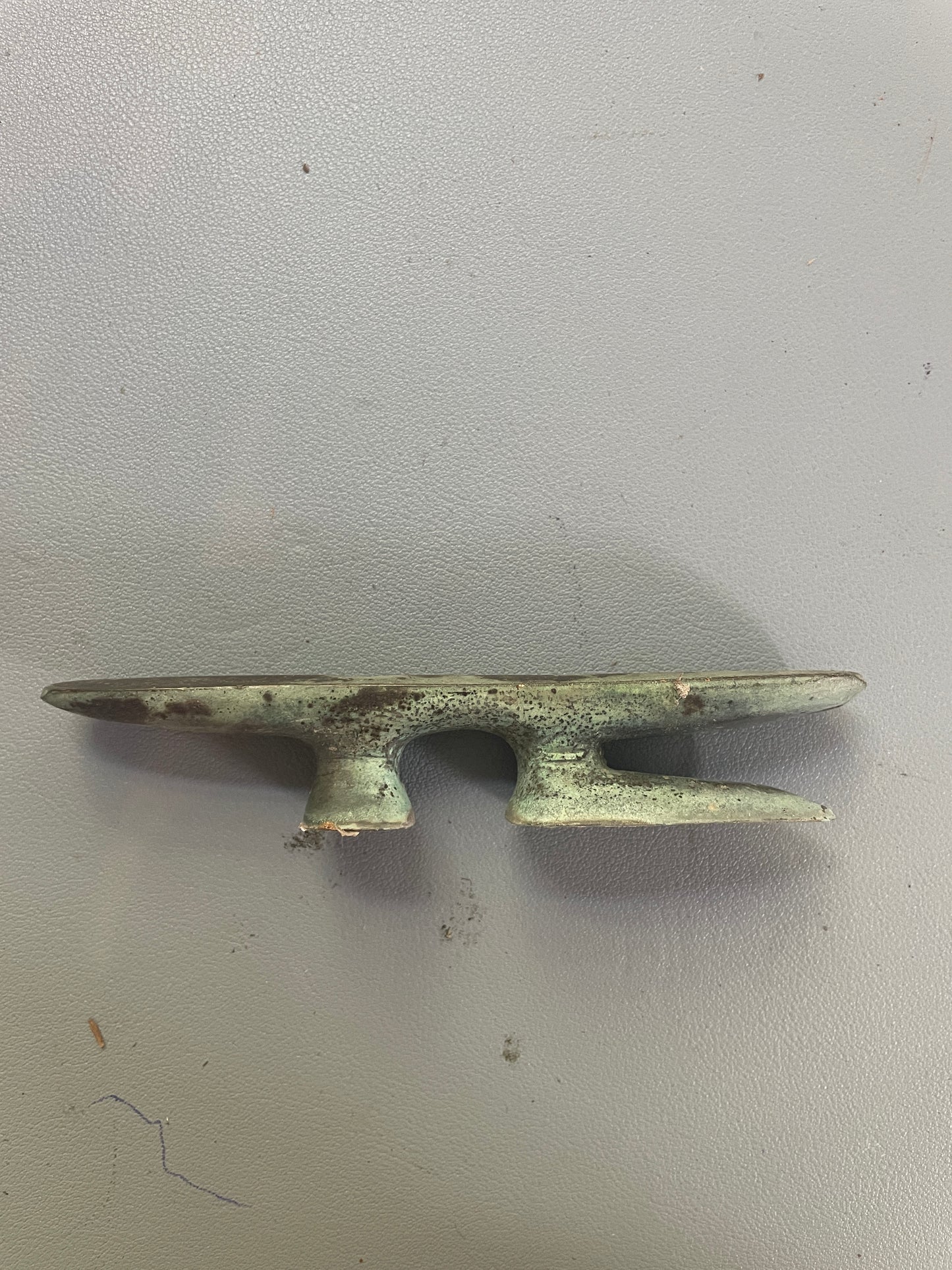 Bronze cleat on a gray background
