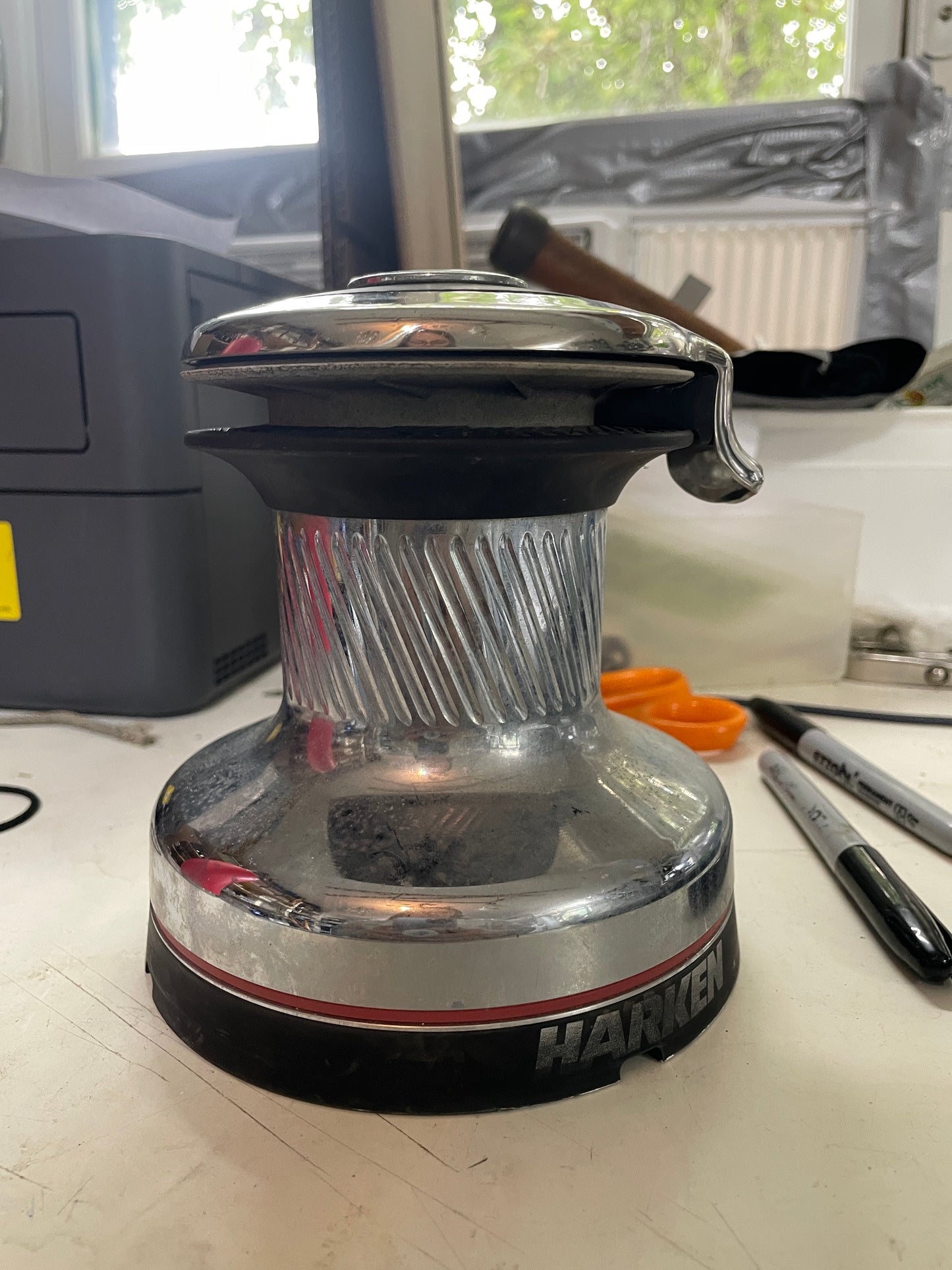 Close-up of a brush attachment on a power tool with a blurred background