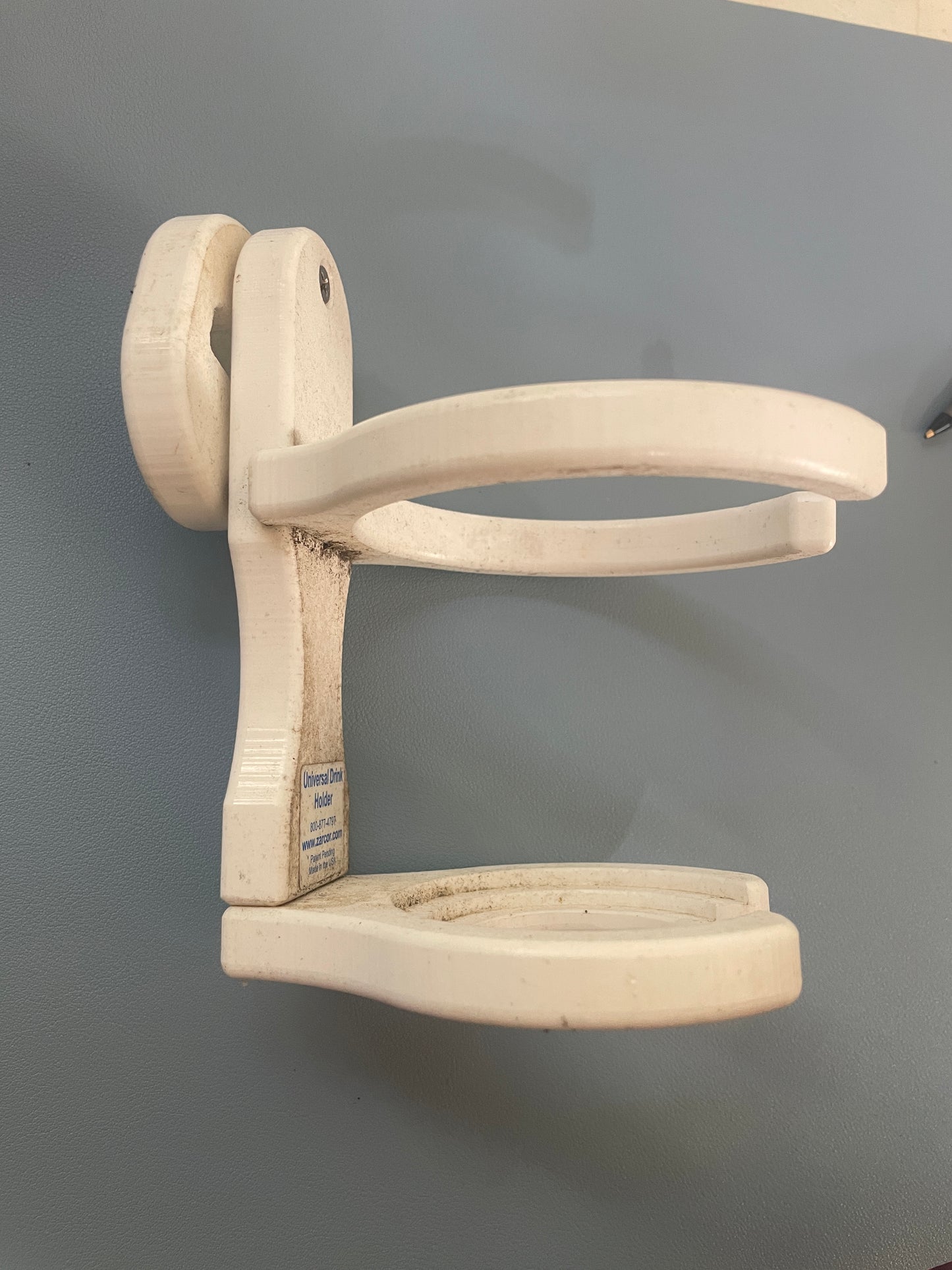 White plastic hanger on a gray background