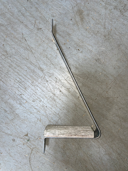 Metal bracket on a concrete floor