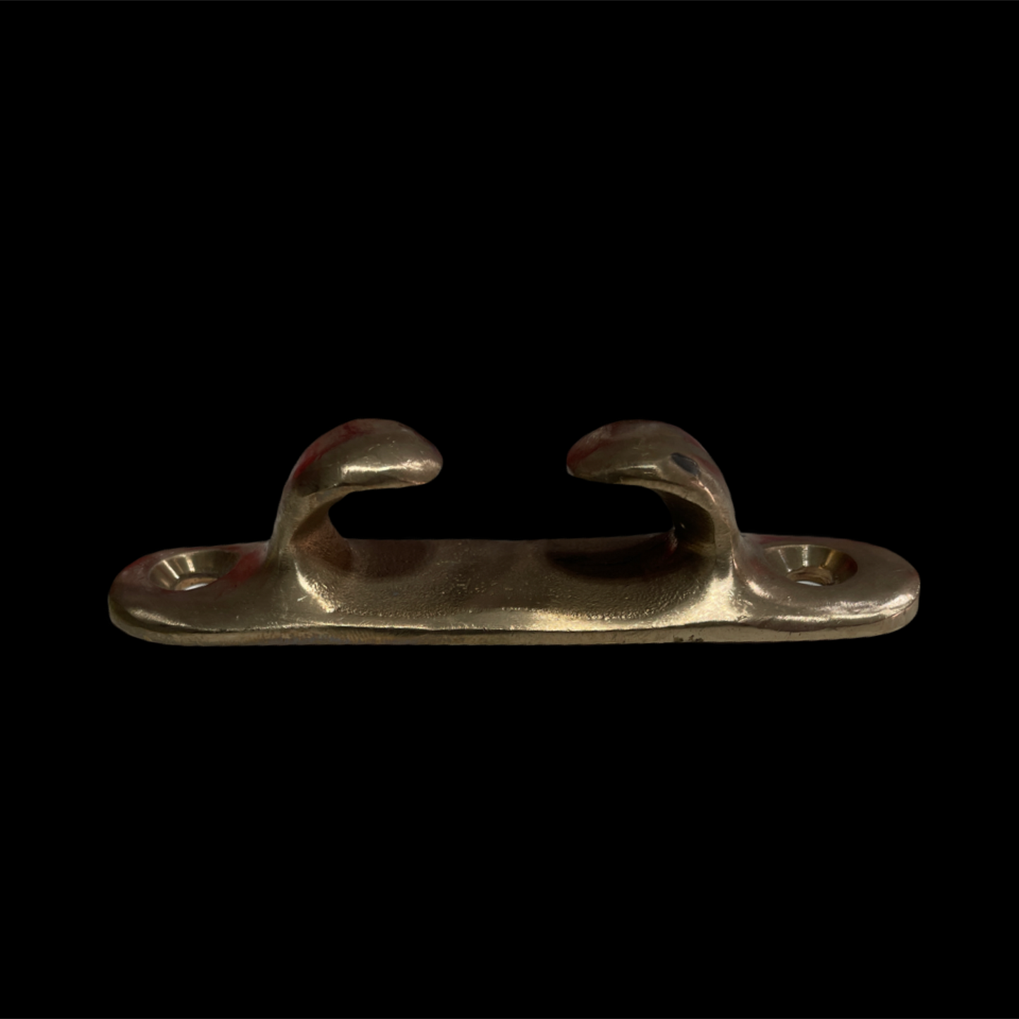 Metallic cleat on a black background