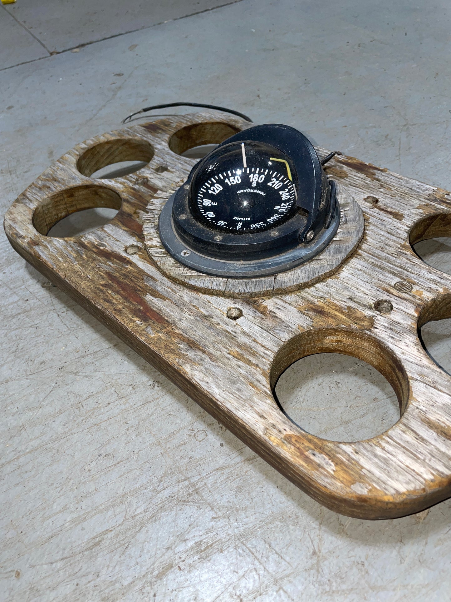 compass with teak cup holder