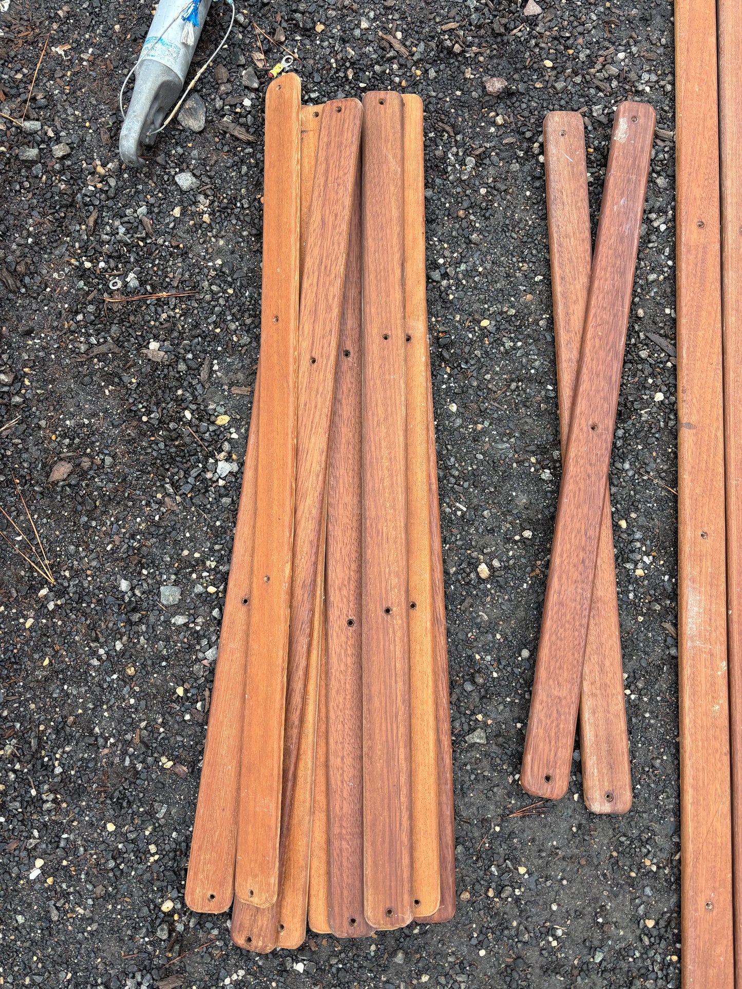 Wooden planks on a dark asphalt surface