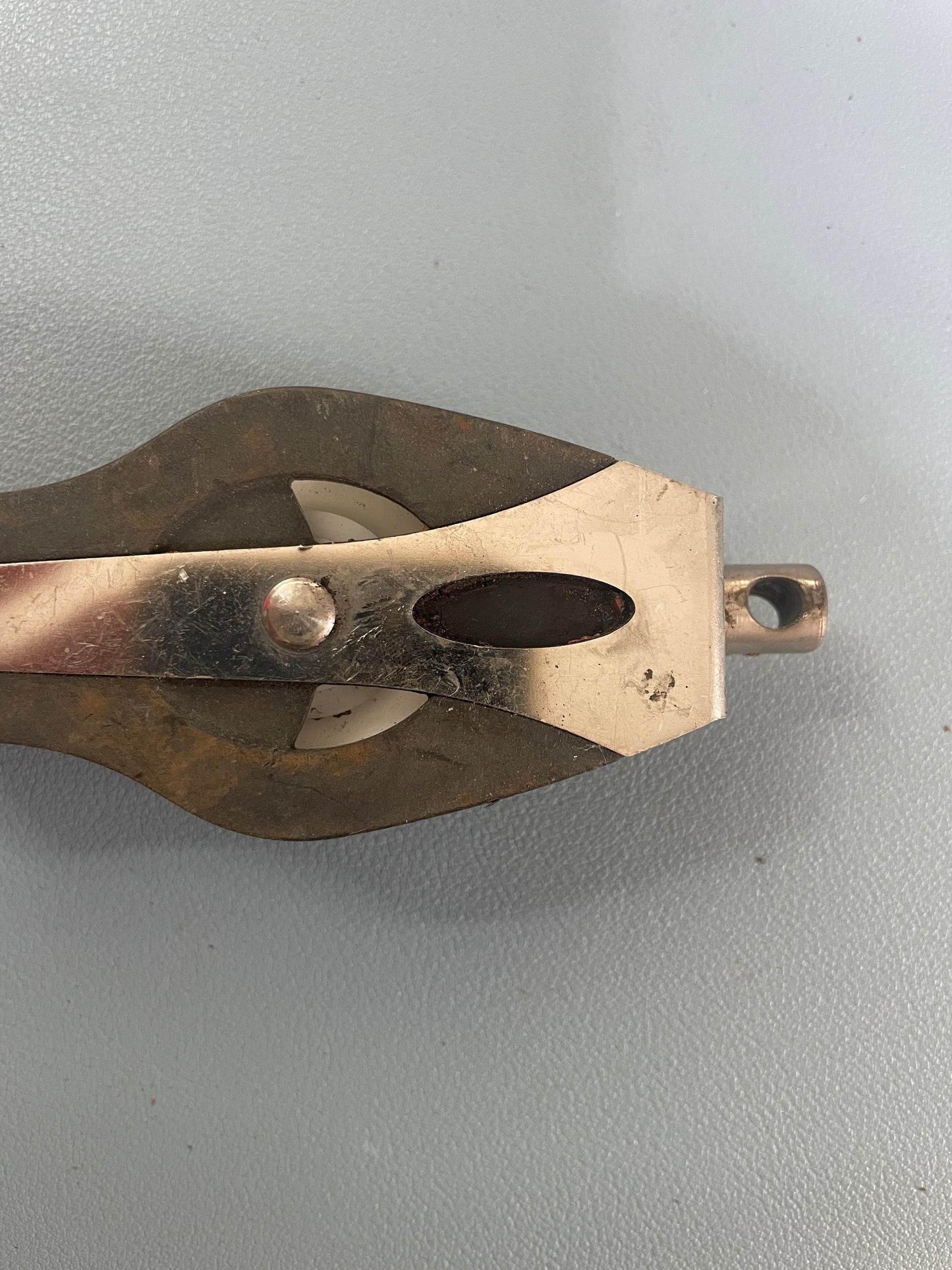 Metal pulley system on a gray background