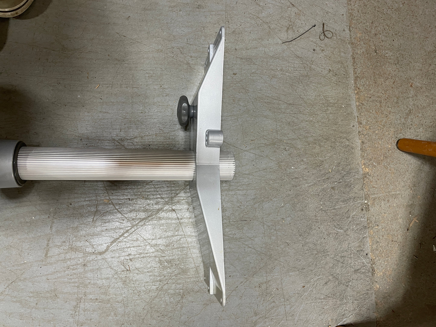 Metal tool with a blade on a textured surface