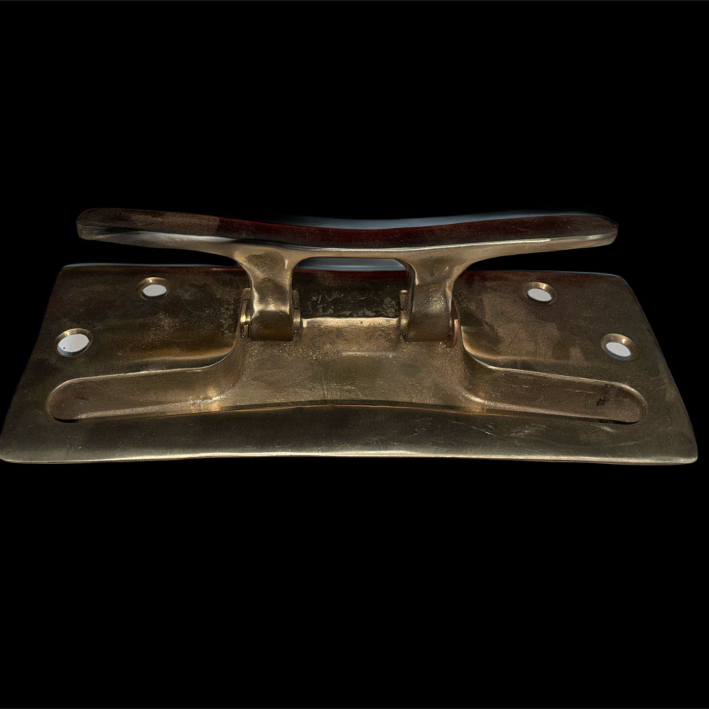 Brass latch on a black background