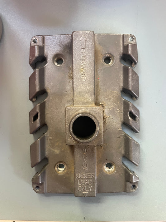 Metallic mechanical component with 'Kicker' branding on a white background