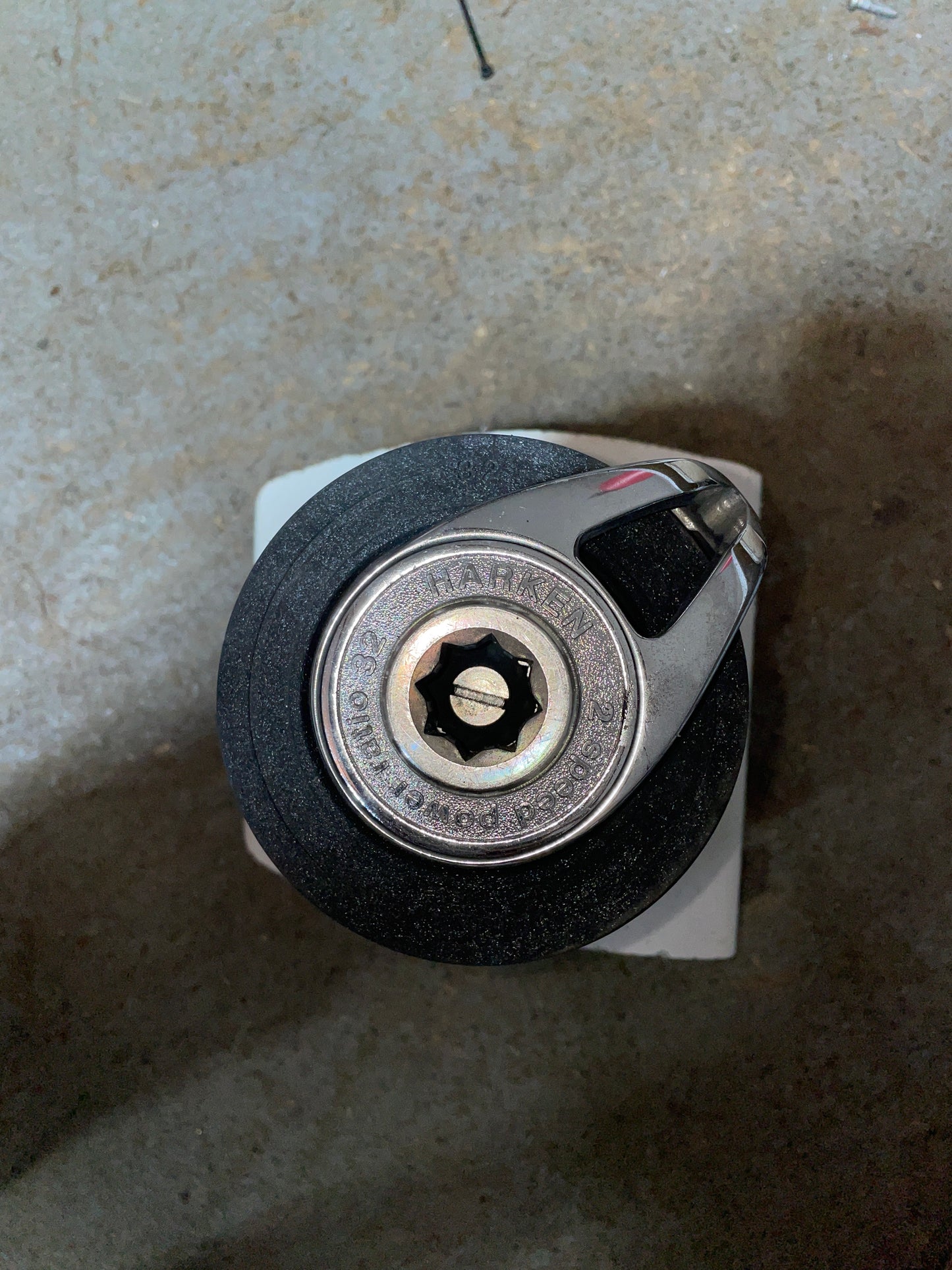Close-up of a metal lock mechanism on a textured surface