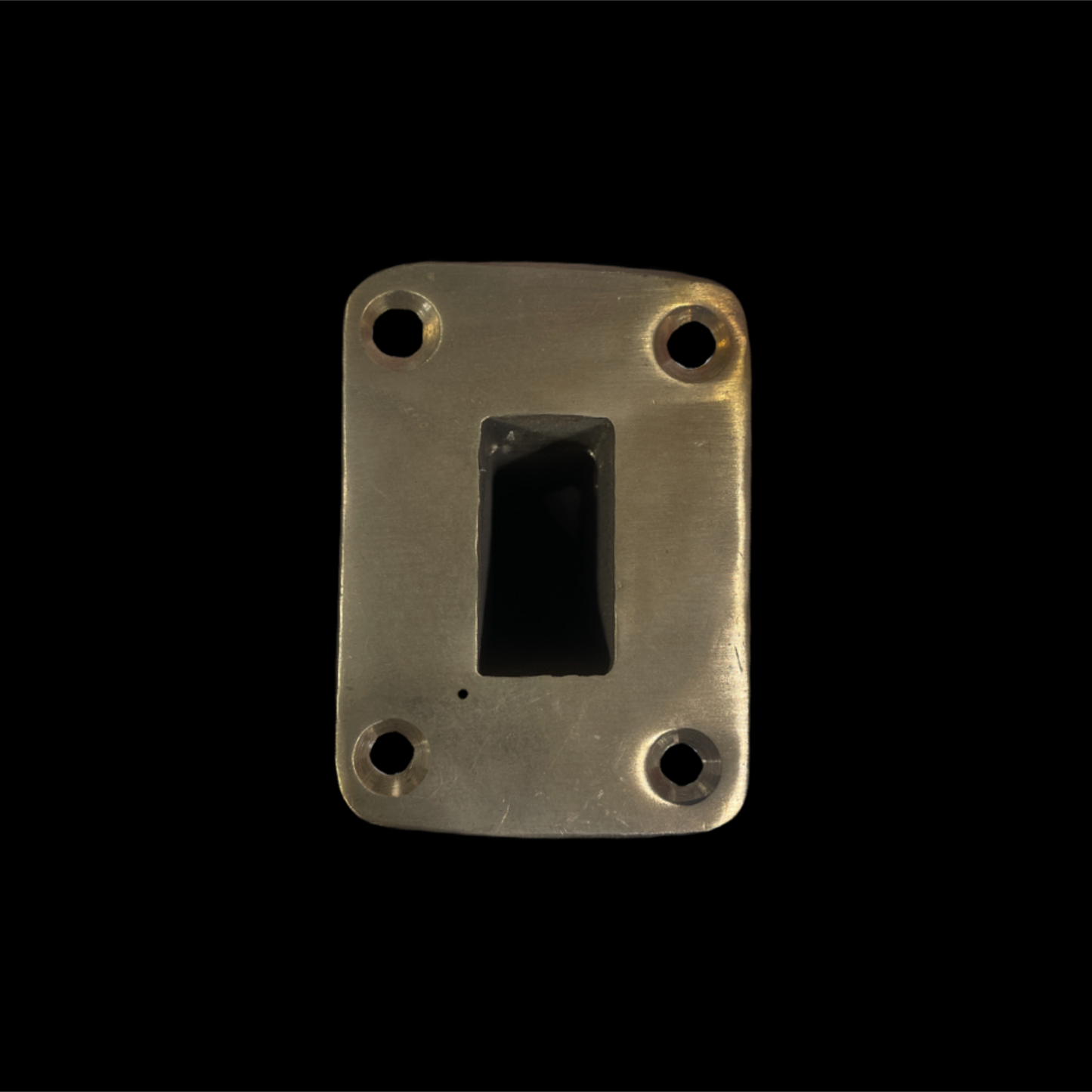 Metallic rectangular object with a central cutout on a black background