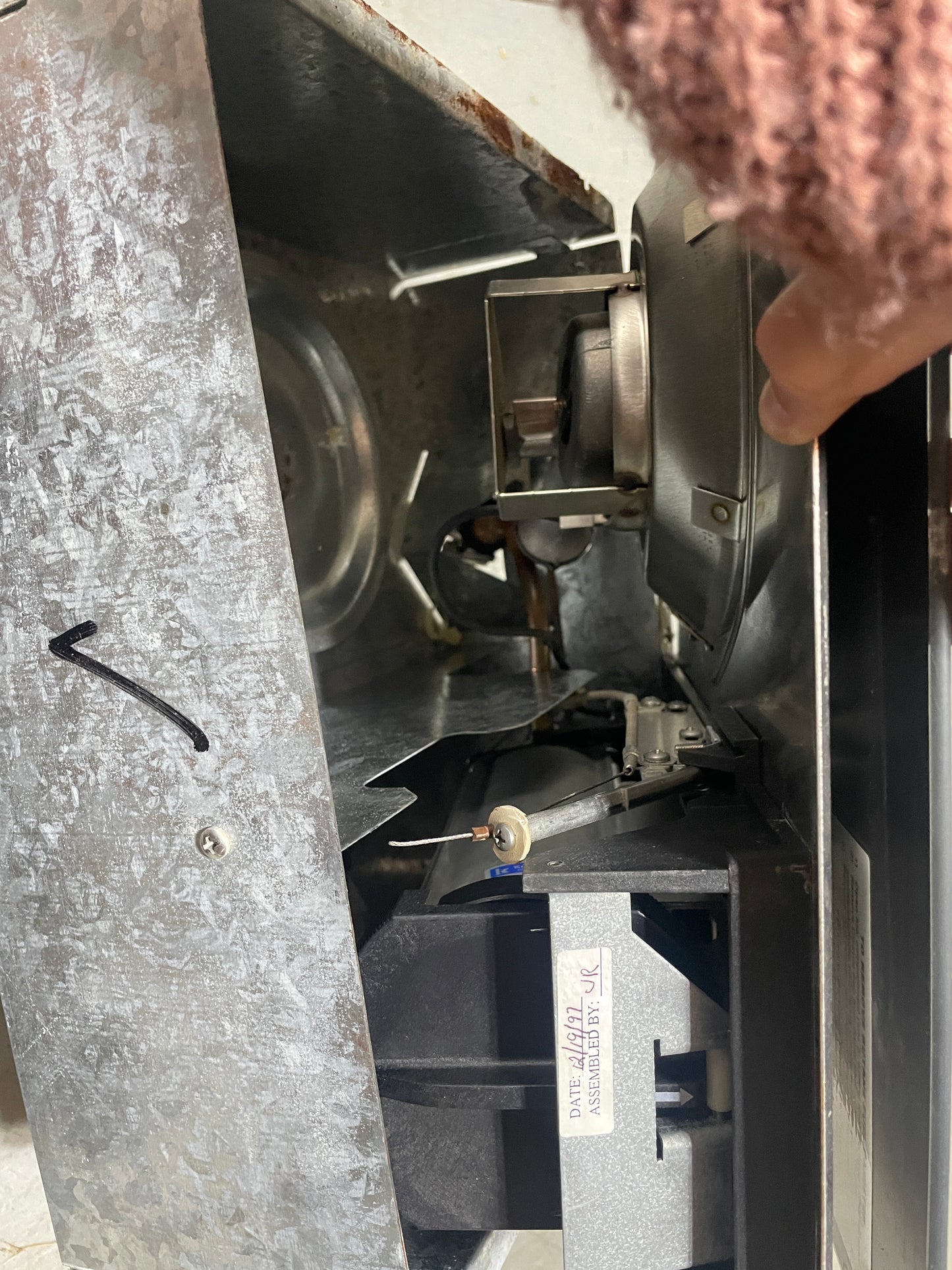 Close-up of a mechanical component inside a metal machine.