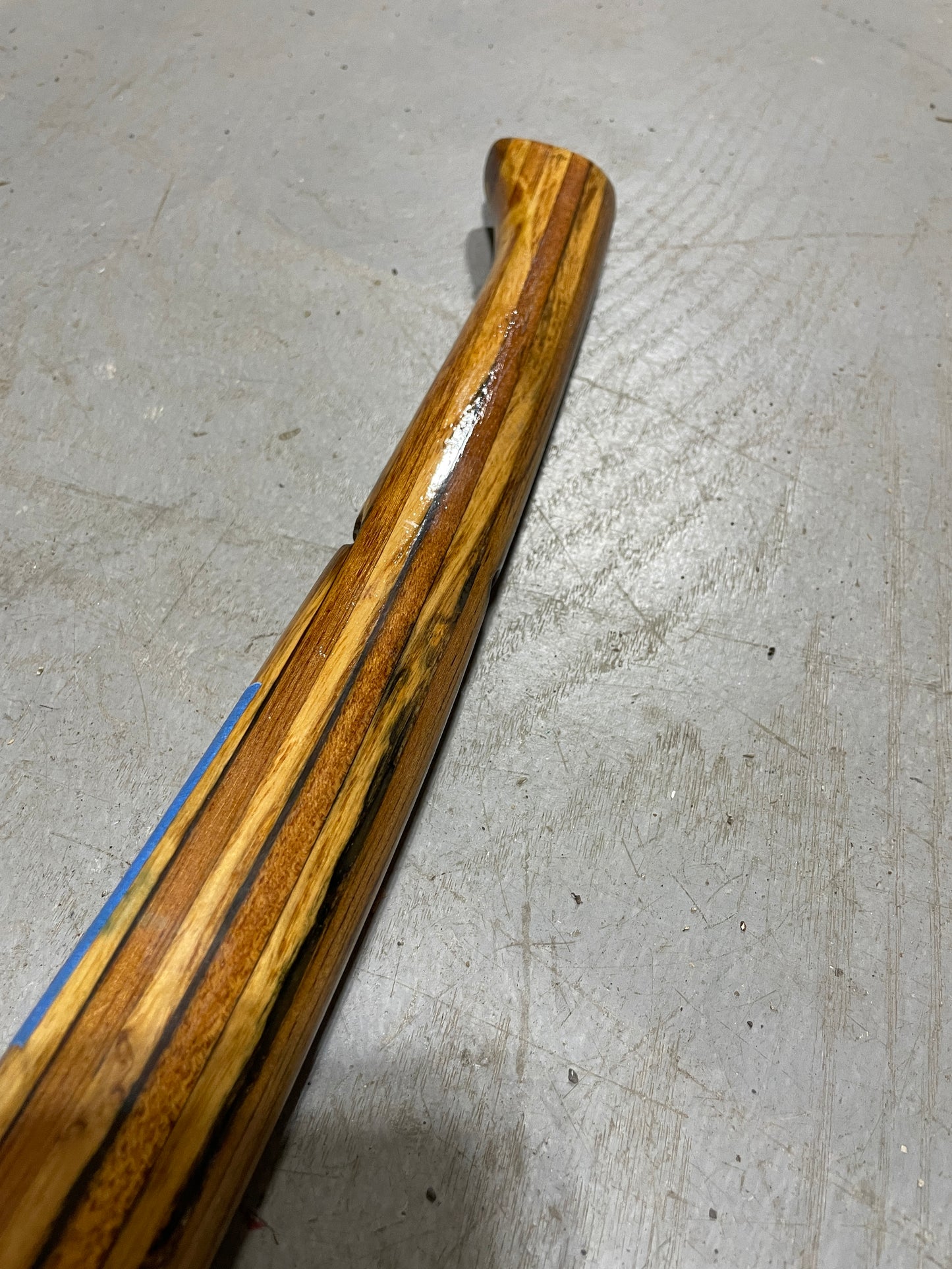 Wooden handle on a metal surface