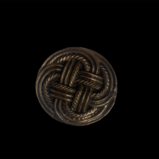 Decorative metal knot on a black background