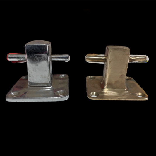 Pair of metallic clamps on a black background