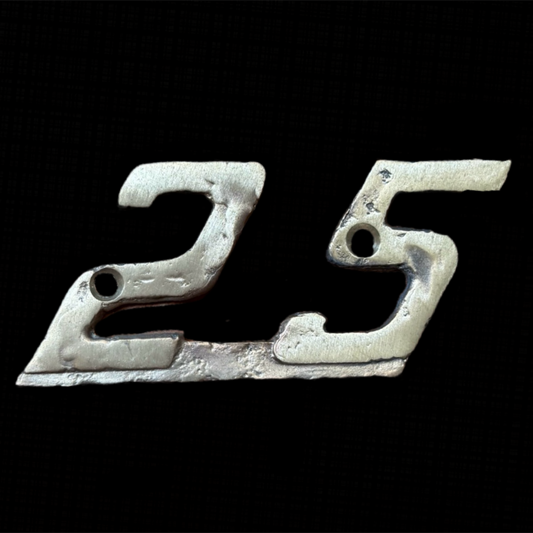 Metallic '25' emblem on a black background