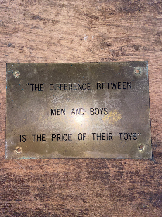“The Difference Between Men And Boys Is The Price Of Their Toys” Plaque