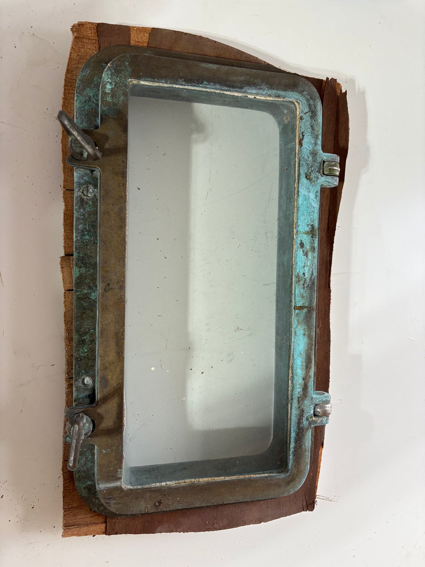 Bronze Portholes off Crealock 37 -- 12"x6"