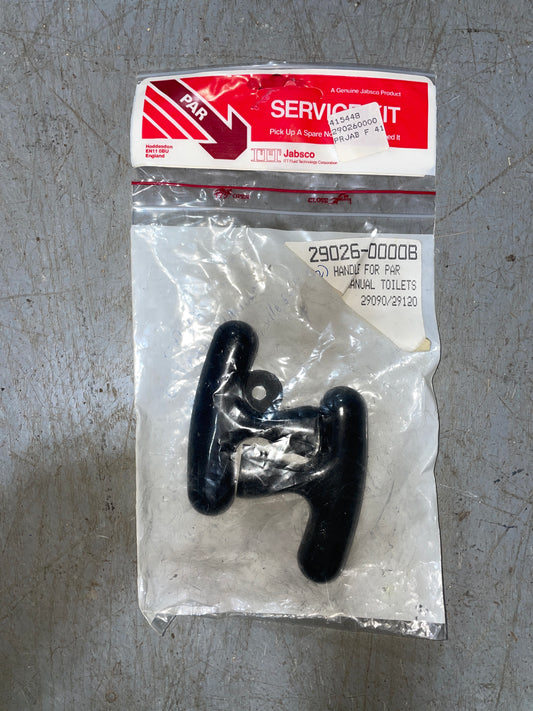 Black toilet handle in clear packaging with a red and white label on a gray surface