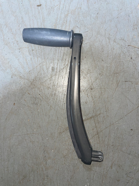 Metal car fender on a gray surface