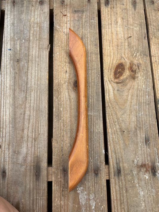 Wooden handle on a wooden surface