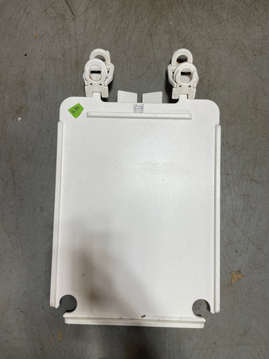 White metal bracket on a gray surface