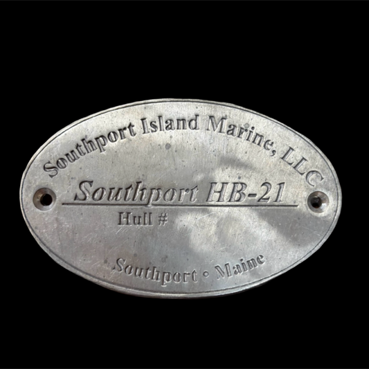Metal plaque with text 'Southport Island Marine, LLC' and 'Southport HB-21 Hull #' on a black background