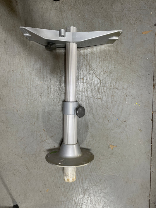 Metal tool or component on a gray surface