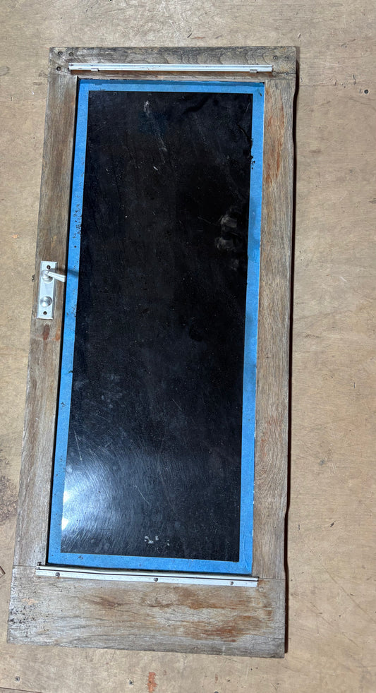 Wooden door with a glass panel on a beige background