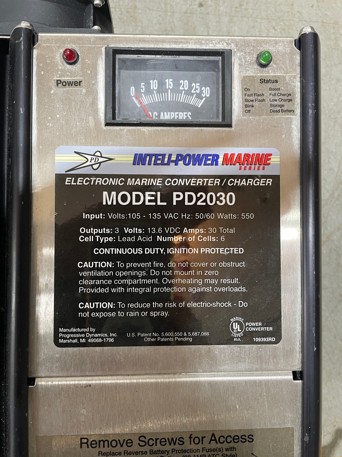 Electronically powered converter charger with label on a metallic surface
