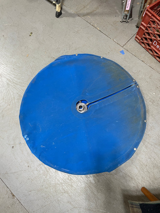 Blue round object on a concrete floor