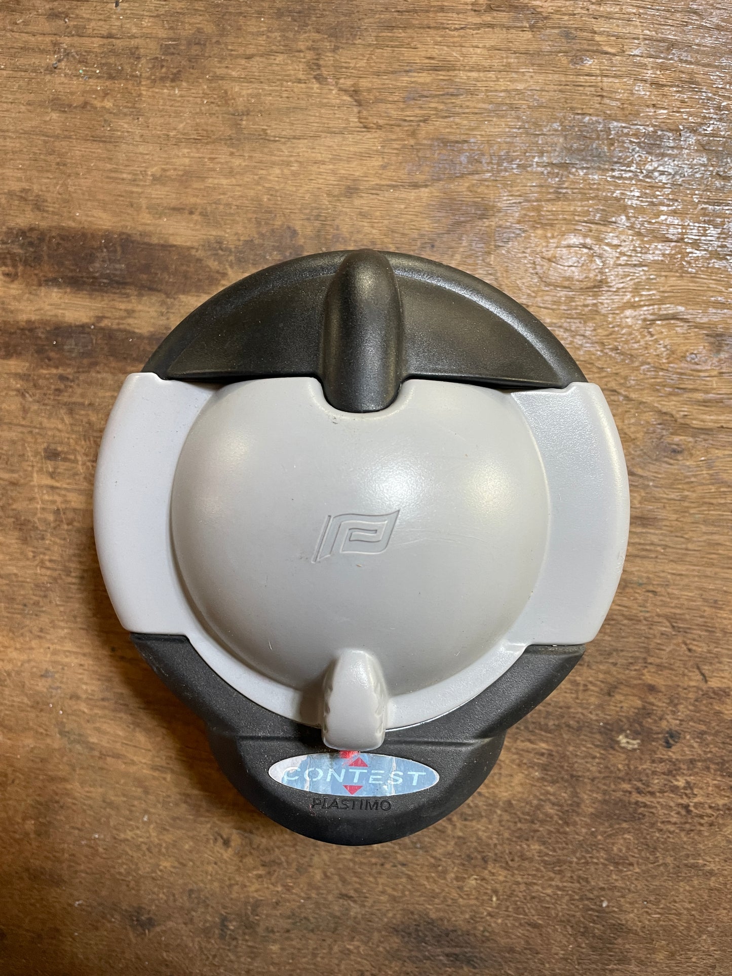 Tea pot with lid on a wooden surface