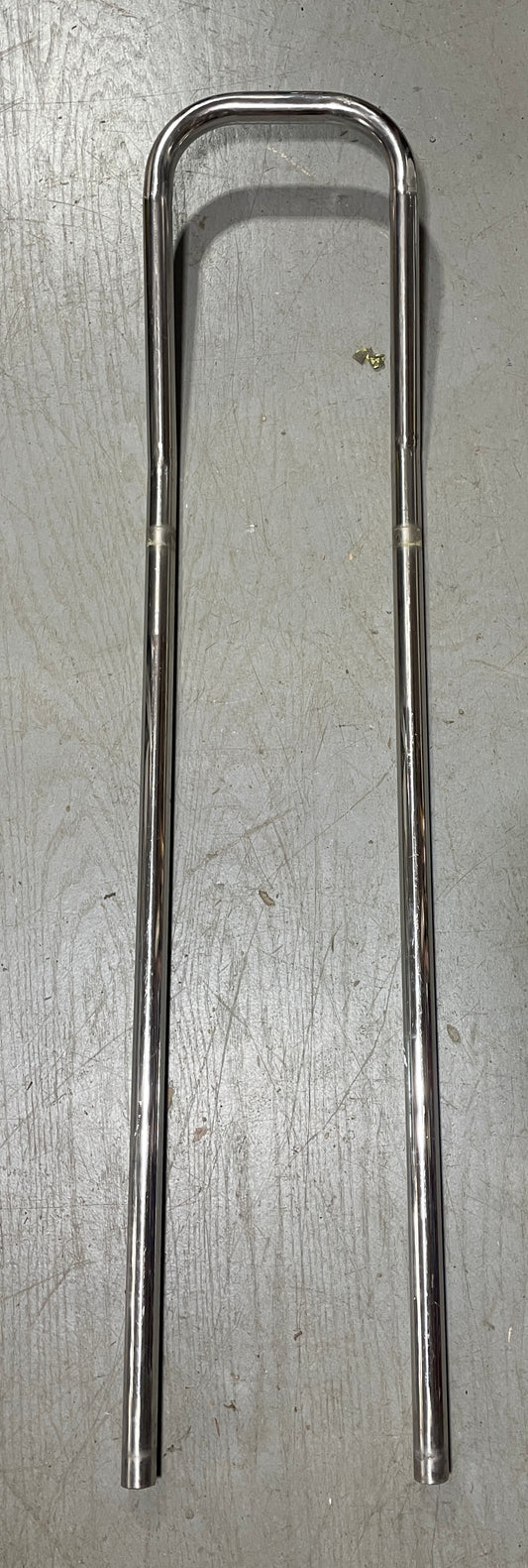 Metallic object on a gray surface