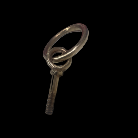 Metal key-shaped object on a black background