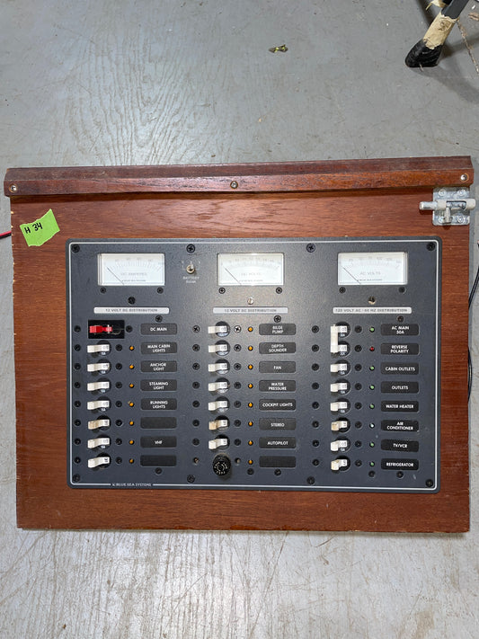 Vintage electronic equipment with wooden casing on a gray surface