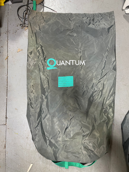 Gray bag with 'Quantum' branding on a concrete floor