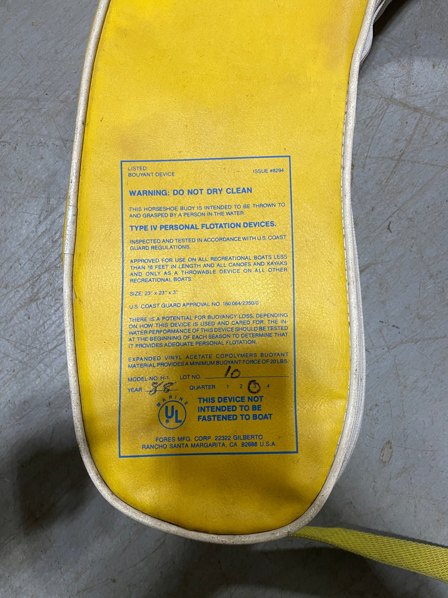 Yellow insole with a label on a gray surface