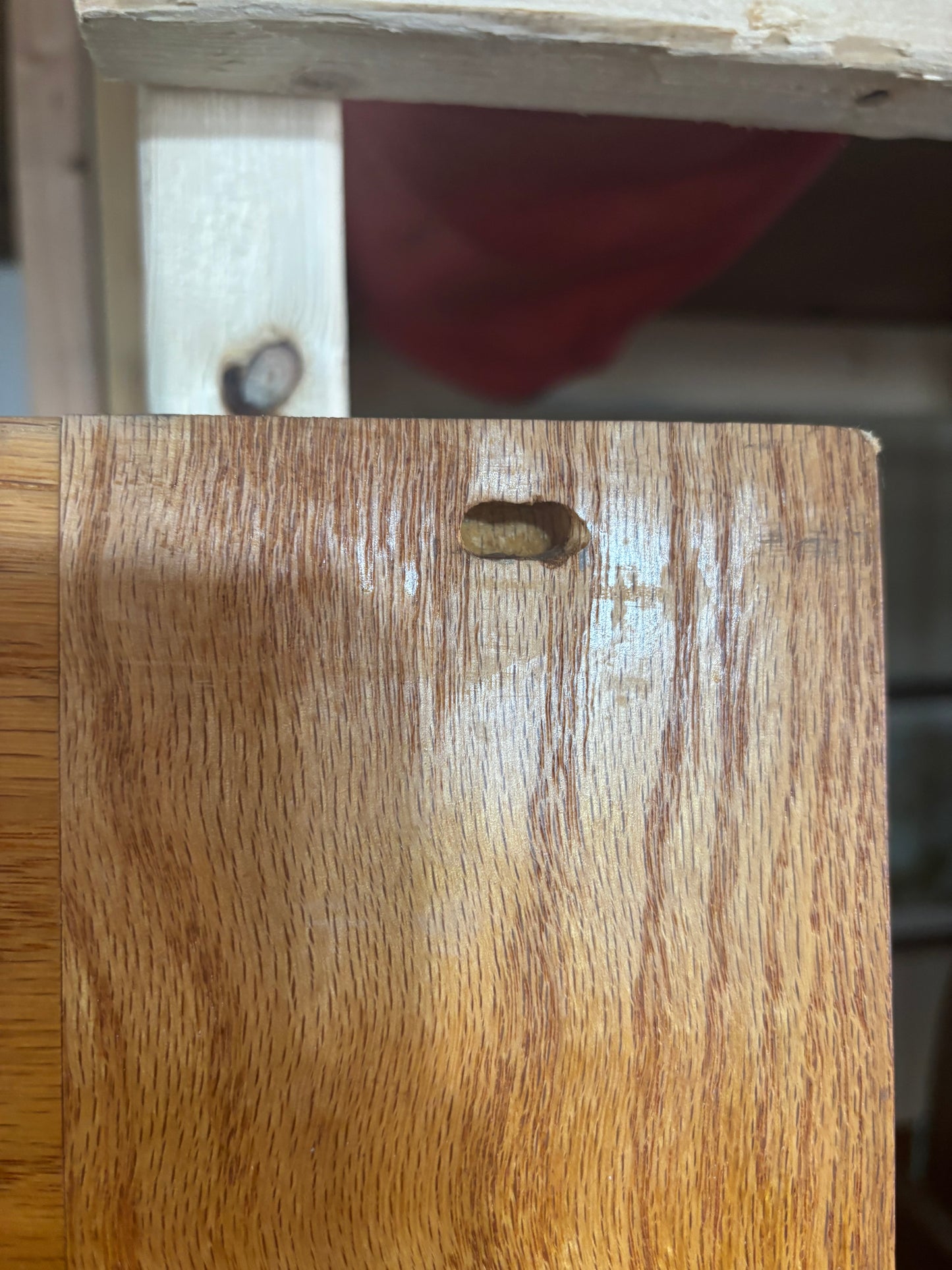Close-up of a wooden surface with a visible knot