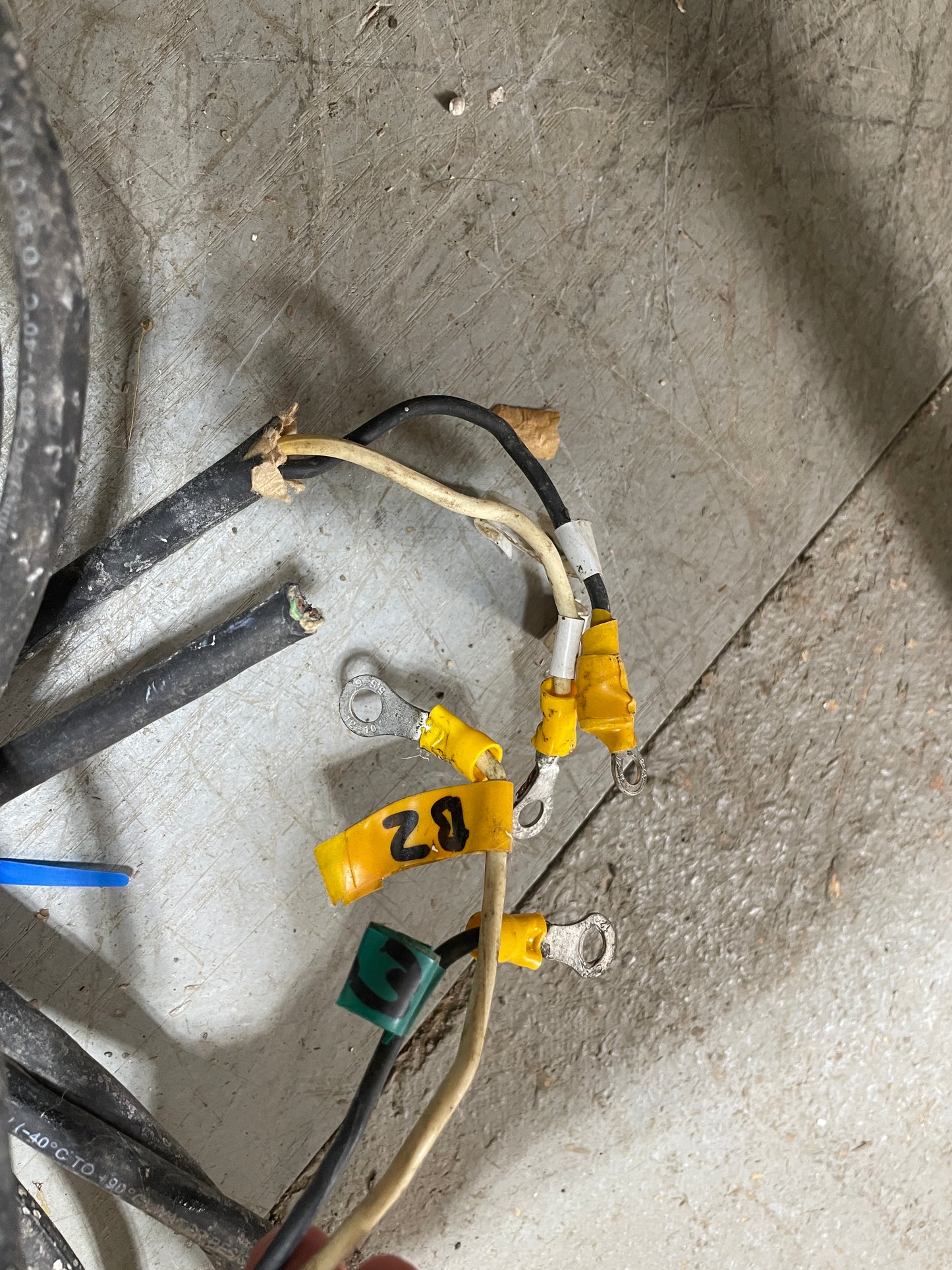 Wired connectors with labels on a concrete floor
