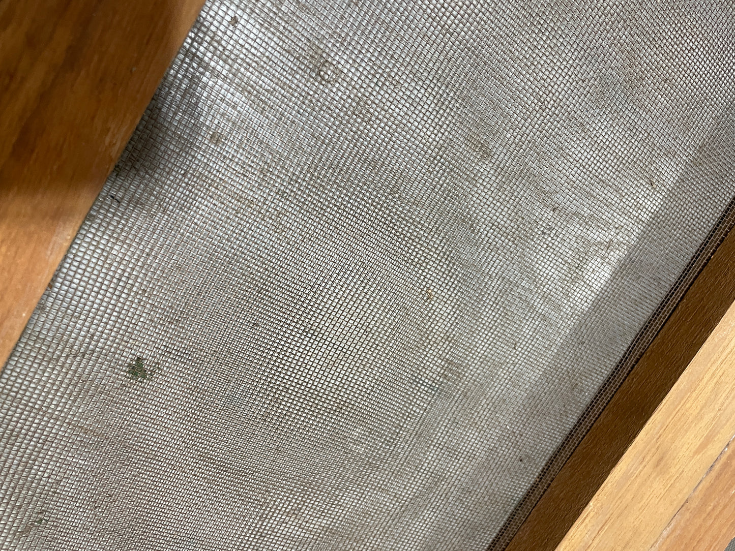 Textured gray mat on a wooden floor