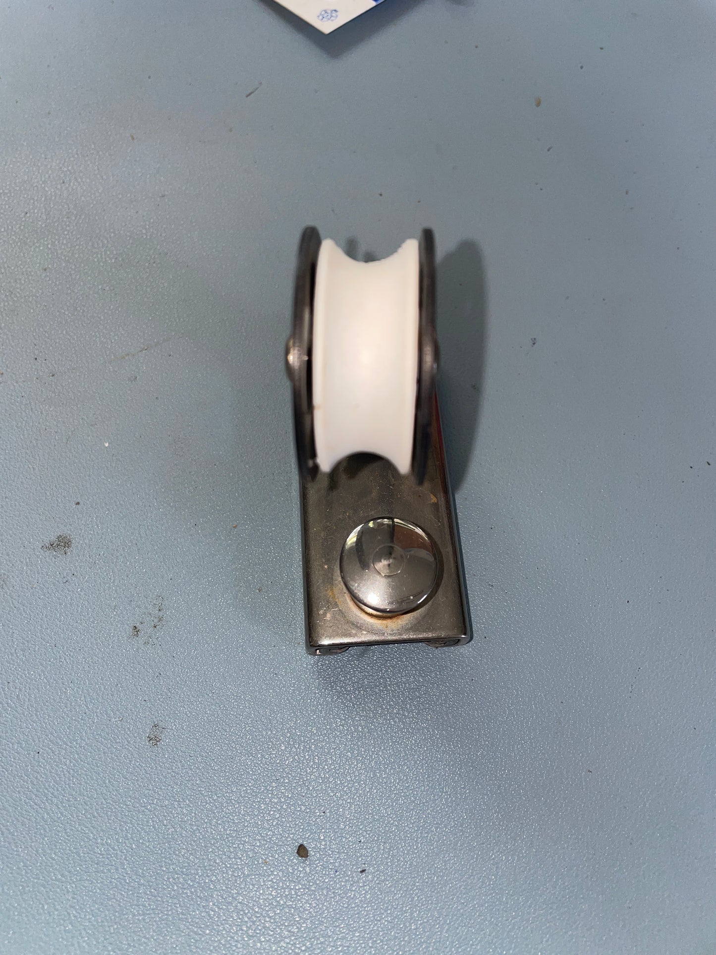 Metal pulley system on a gray background
