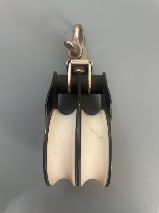 Mechanical pulley system on a gray background