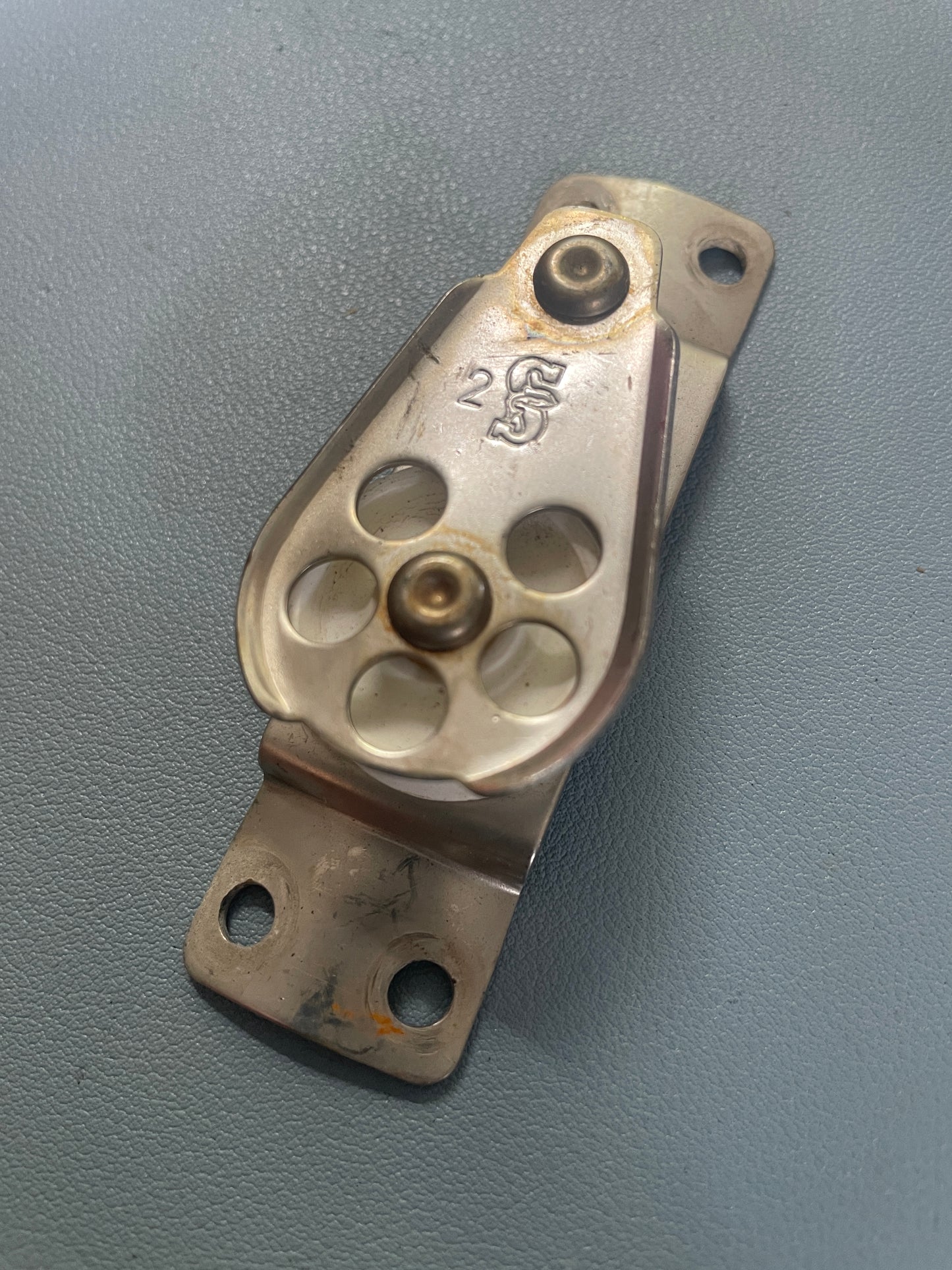 Metal mechanical component on a gray background