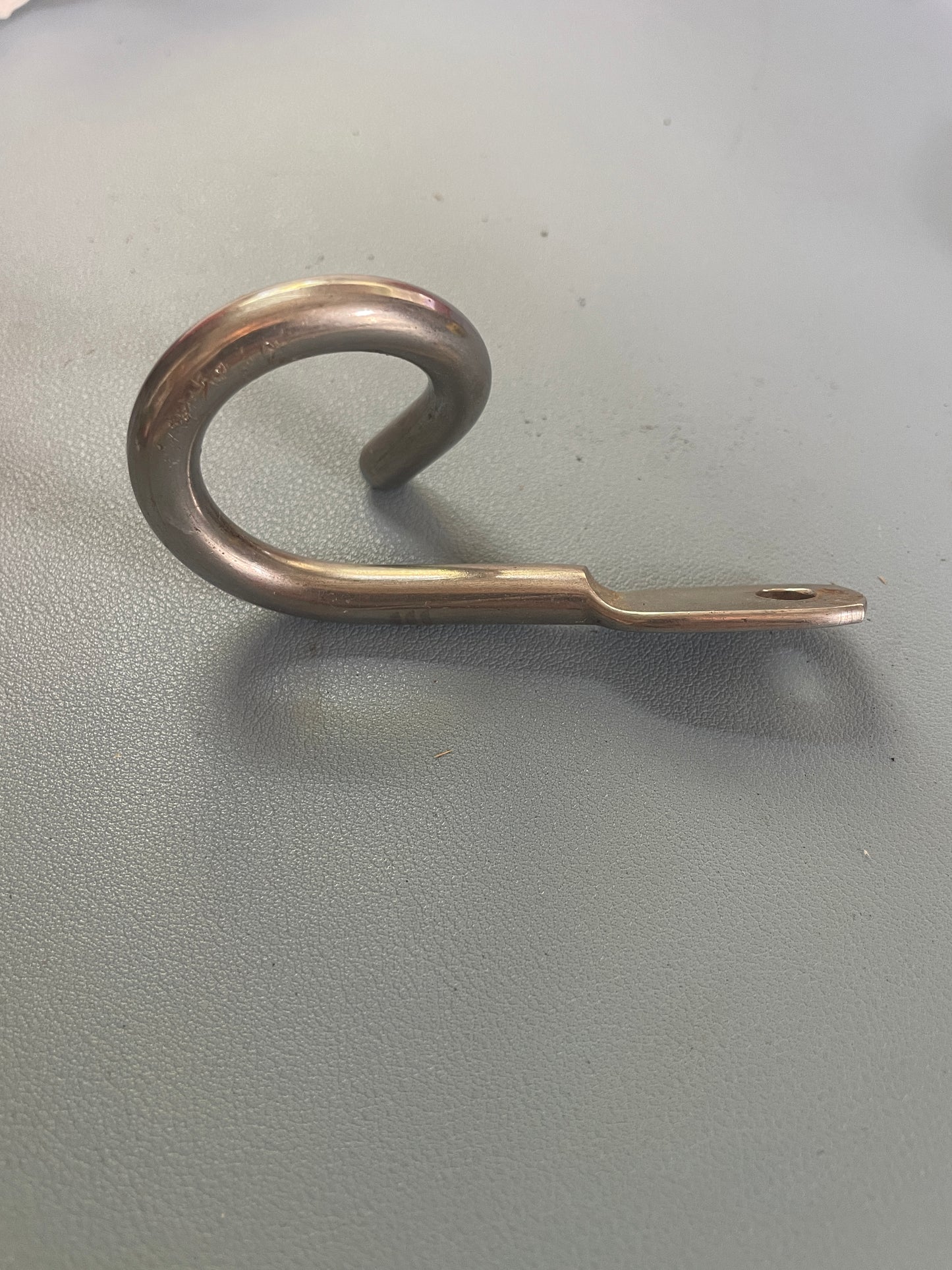 Metal hook on a gray background