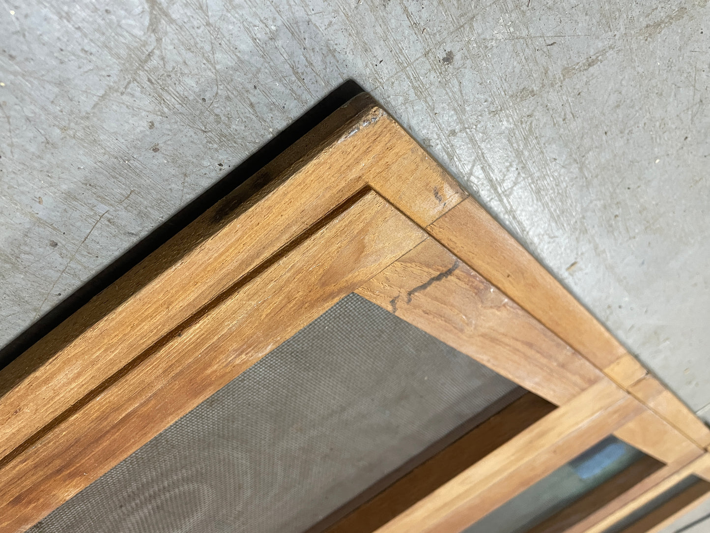 Wooden frame corner on a concrete floor