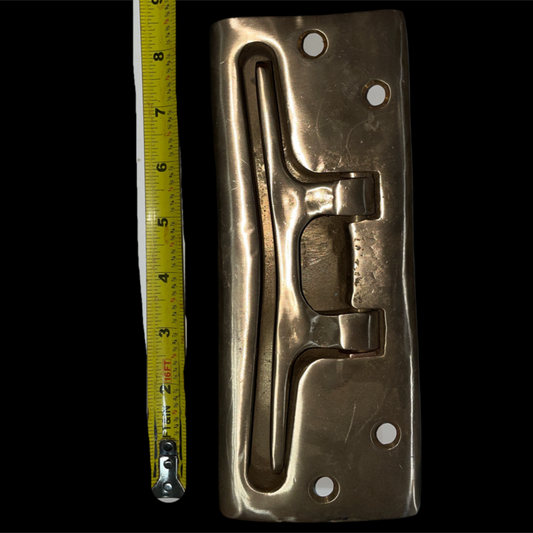 Metallic object with measurement tape on a black background