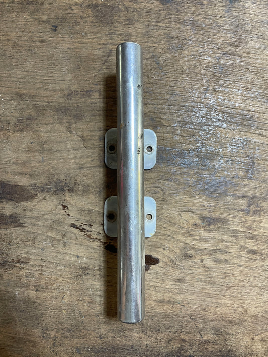Metal bracket on a wooden surface