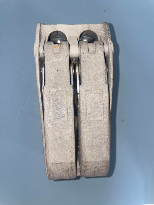 Multi-tool with a metallic finish on a gray background