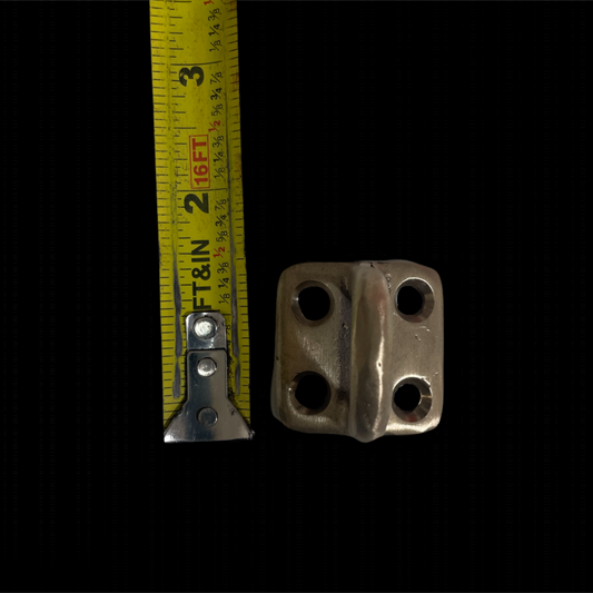 Metallic bracket with measurement tape on a black background